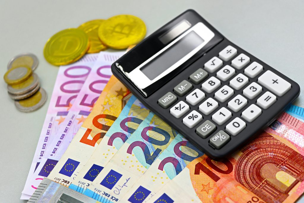 pexels photo 33000309 33000309 Euro Banknotes with Cryptocurrency and a Calculator